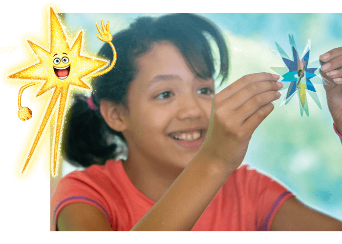 Girl playing with Imagination Station Day 1 Star Spinner Kit